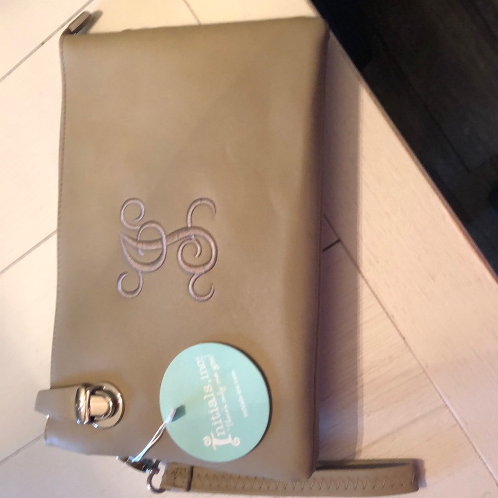 Initials inc cross body purse. Never been used.